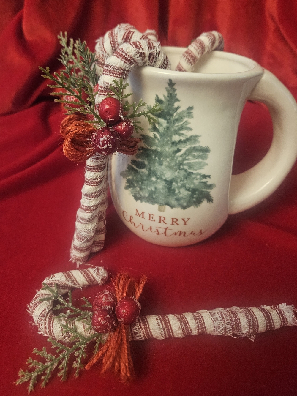 Three White Fabric Covered Candycanes with Greenery, Red Berries and Twine